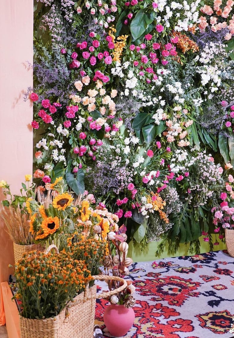 a large flower arrangement in a room with a rug rug