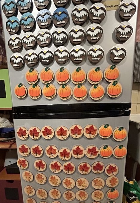 laser engraved and painted mountain and pumpkin souvenir magnets