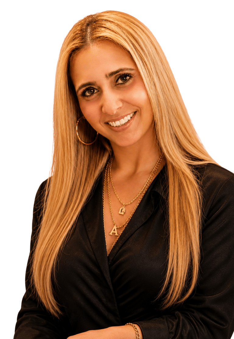 Professional headshot of a smiling woman with long blonde hair, gold jewelry, and a black blouse.