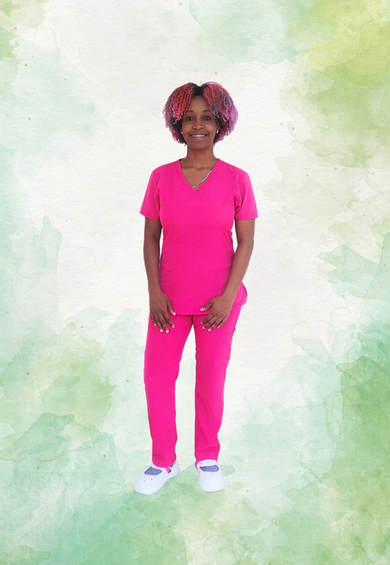 a woman in a pink scrub suit standing in front of a green background