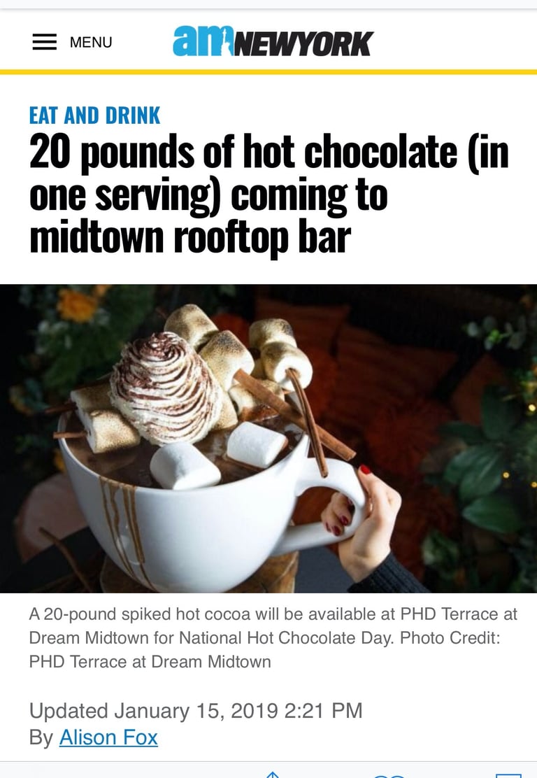 a person holding a cup of coffee and a cup of coffee