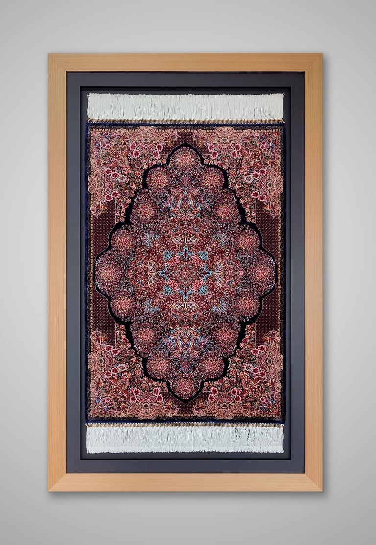 An oriental carpet framed in a natural wooden frame and set against a black border and backing.