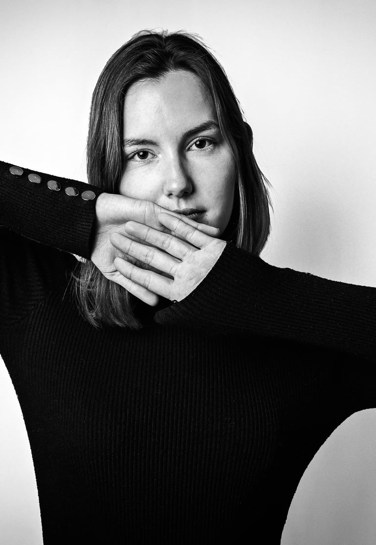 Expressive black and white portrait of a woman with a calm intense gaze