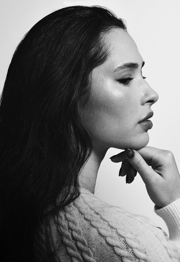 Black and white fine art profile portrait of a woman in a soft cinematic mood