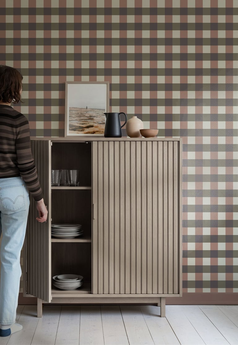 Earthy multicolor plaid wallpaper with a rustic check pattern, styled with natural wood furniture