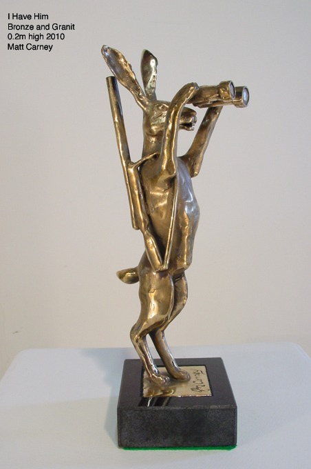 a statue of arabbit with binoculars and a gun