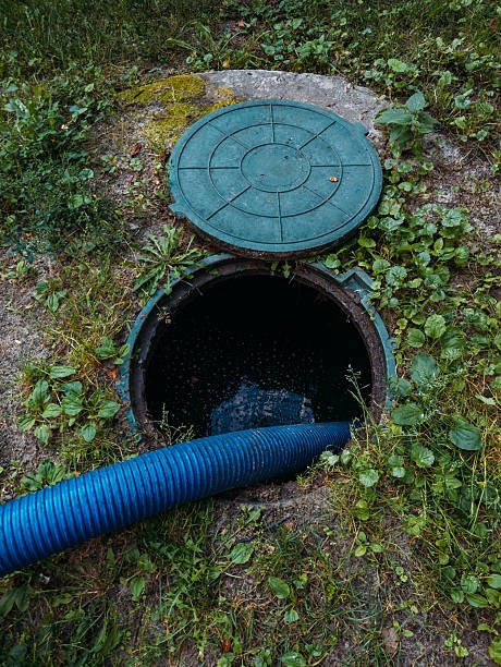 hose pumping out a septic tank
