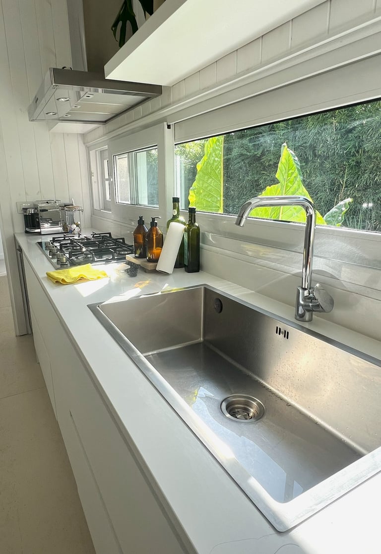 a kitchen with a sink and a window