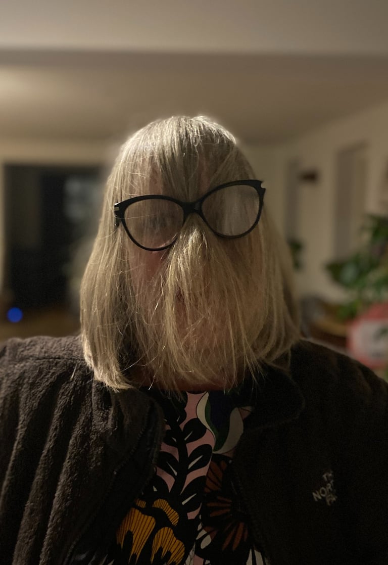Funny face of women with hair in  front of face but behind glasses