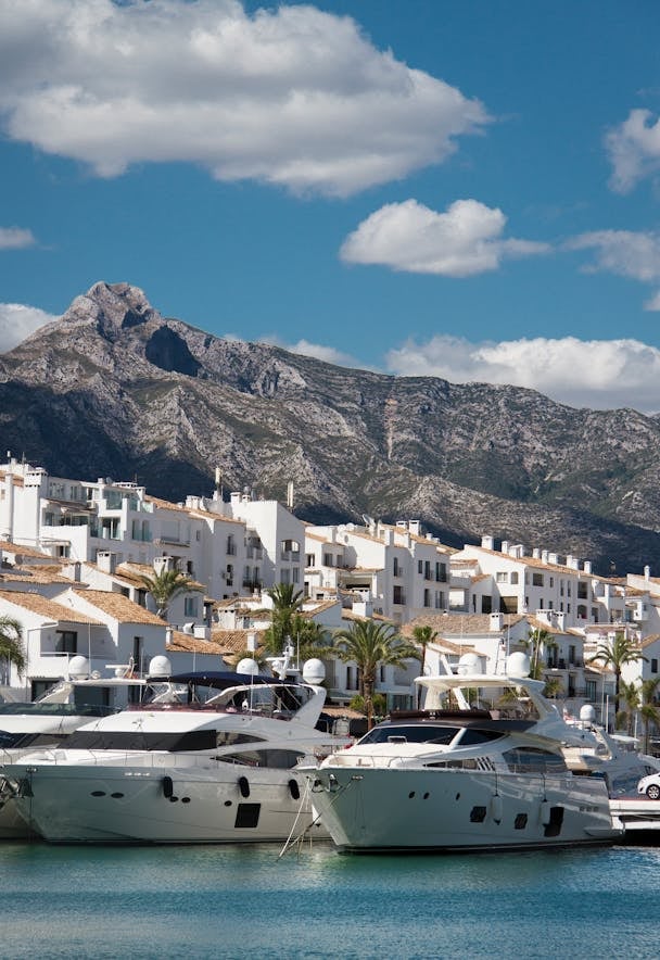 View of Puerto Banus, the iconic marina in Marbella with La Concha mountain in the background