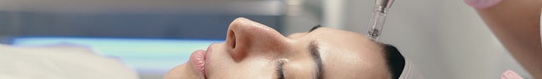 a woman is getting her face and neck examined by a doctor