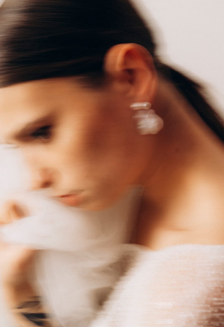 a woman in a white dress with a white veil