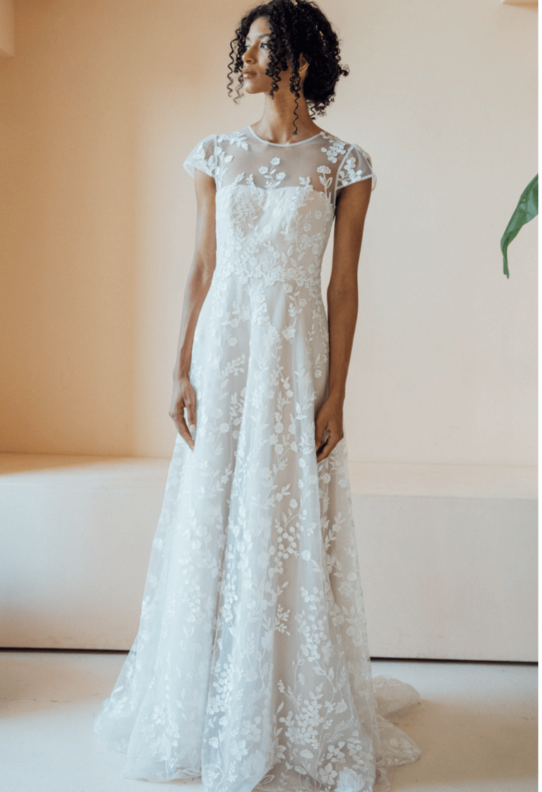 a woman in a white dress with a white dress