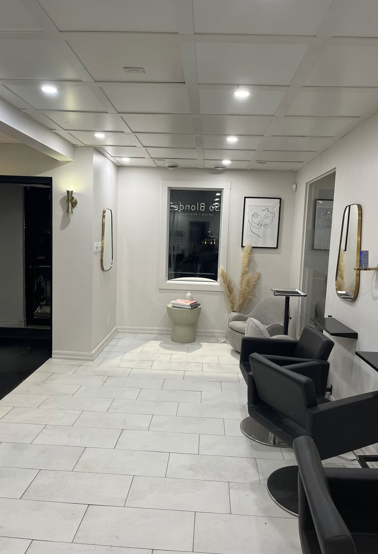 a bathroom with a toilet and a tub in the middle of the room
