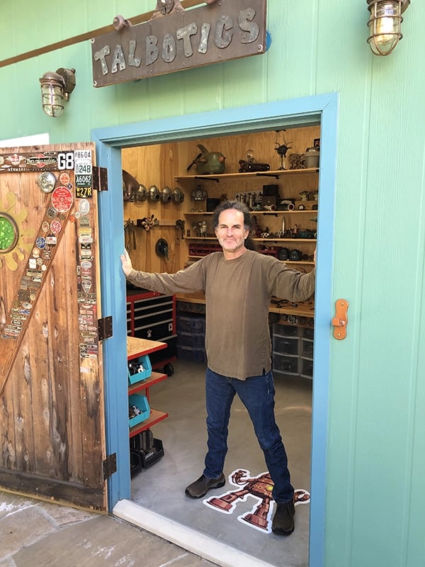 Santa Barbara artist Tal Avitzur standing at the doorway into his workshop.