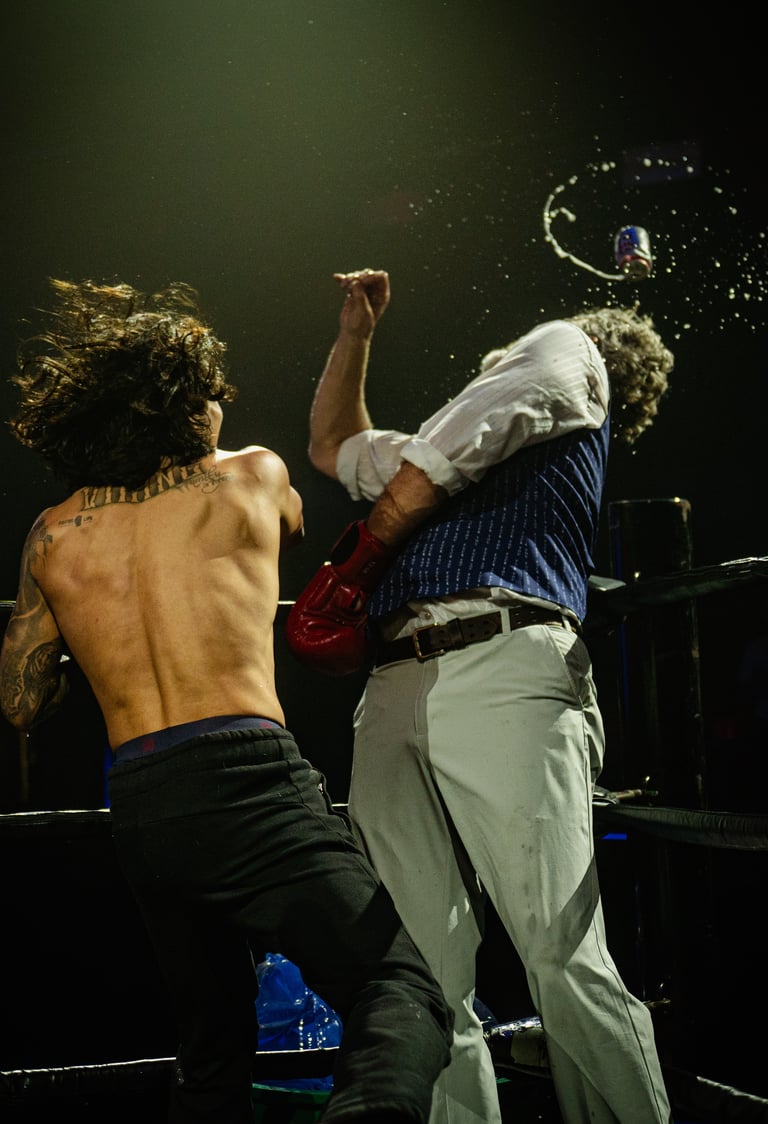 person getting punch with beer flying in the air
