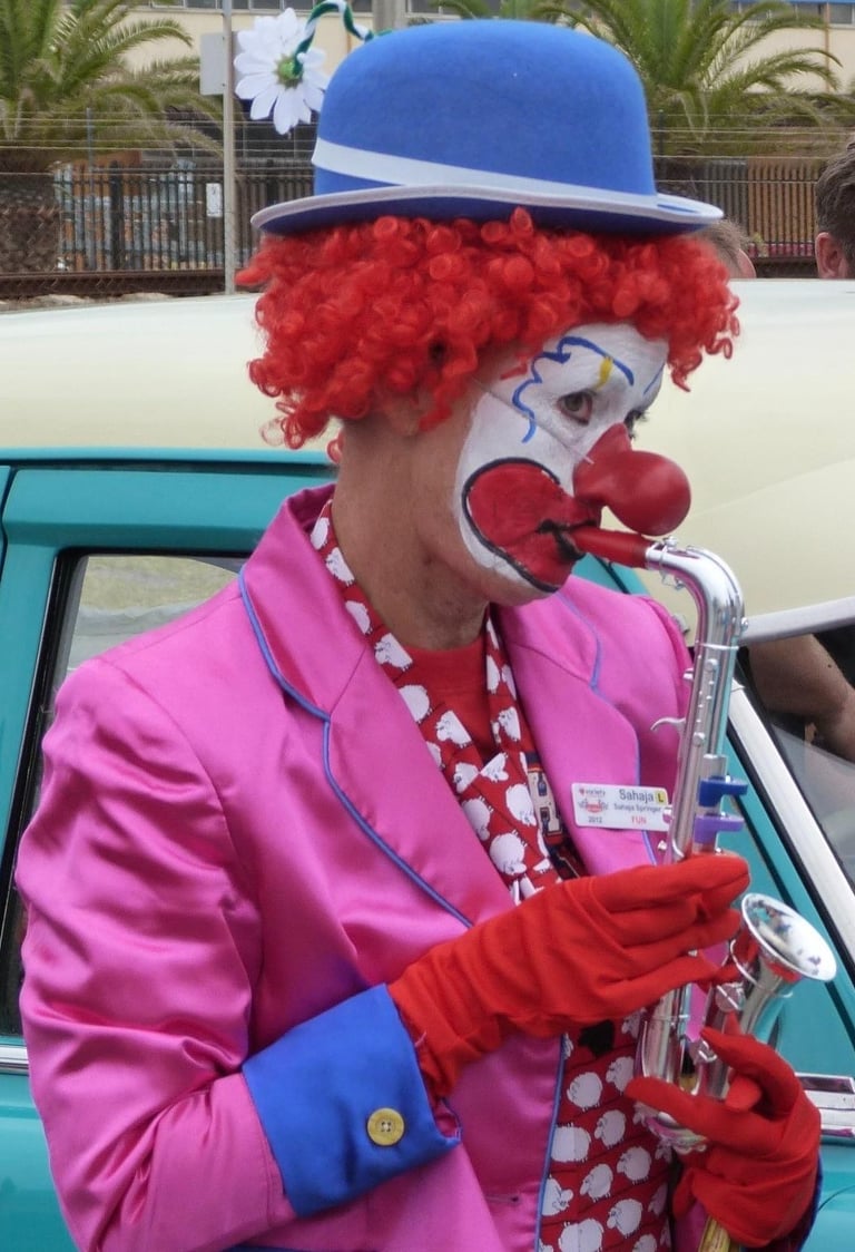 Clown playing a toy saxaphone