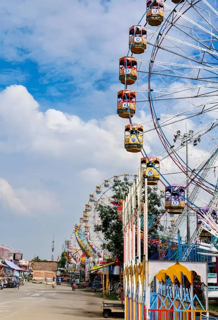 Morning view of giant wheels and amusement rides at Kota Dussehra Mela.