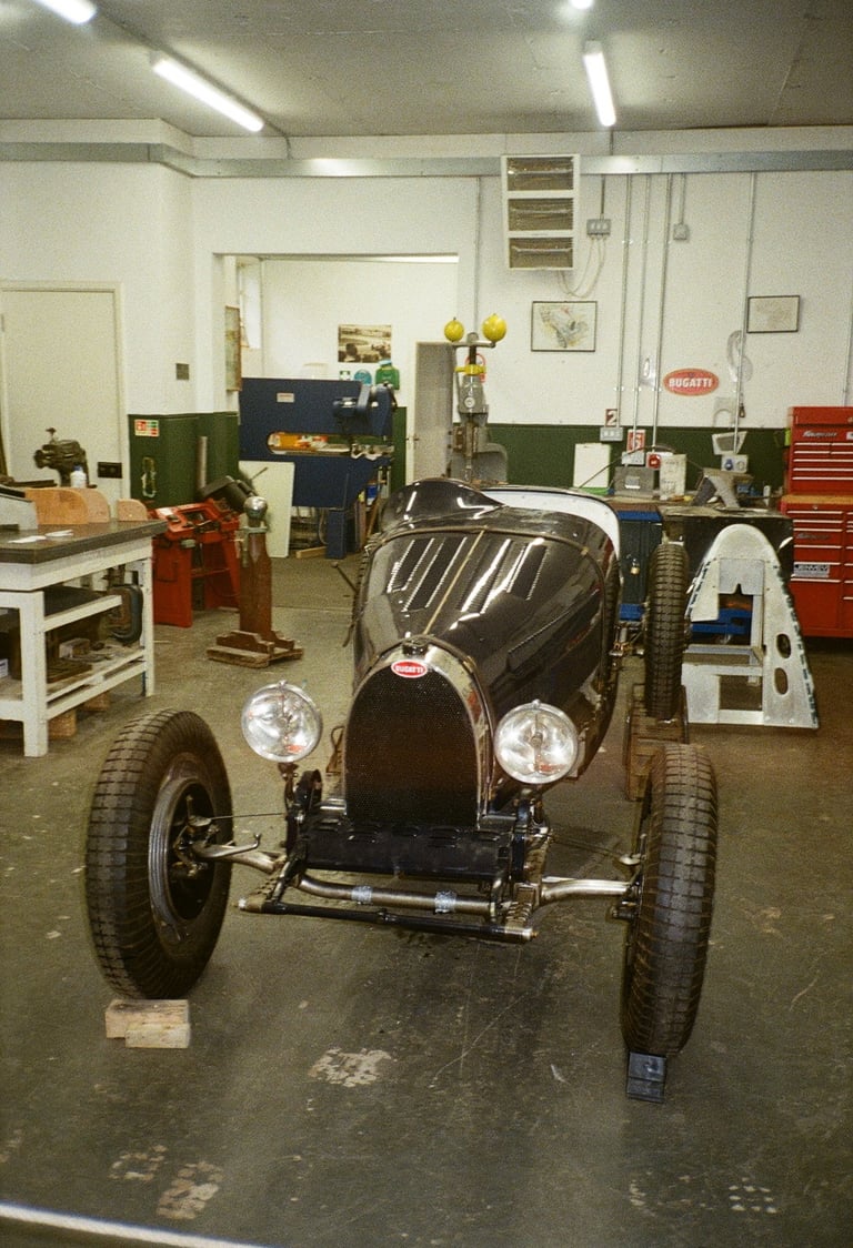 a vintage car parked in a garage