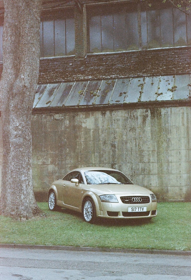 an Audi TT parked on grass 