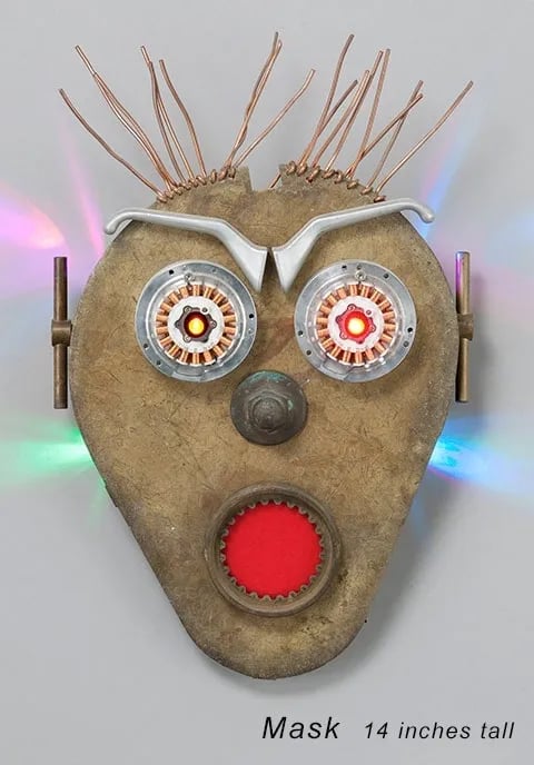 Found object robot head with surprised look built by artist Tal Avitzur.