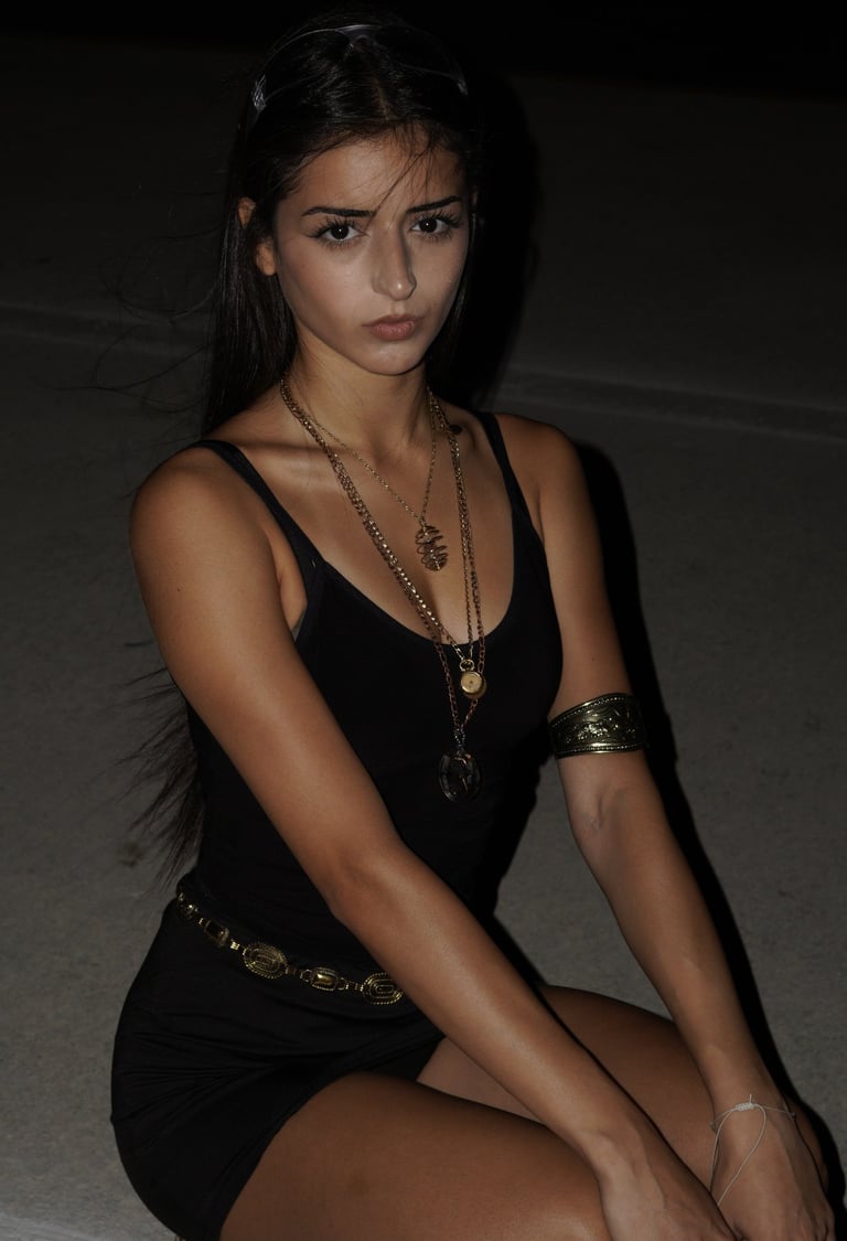 Miami lifestyle portrait of a young woman in black dress and gold jewelry with natural light by Fran