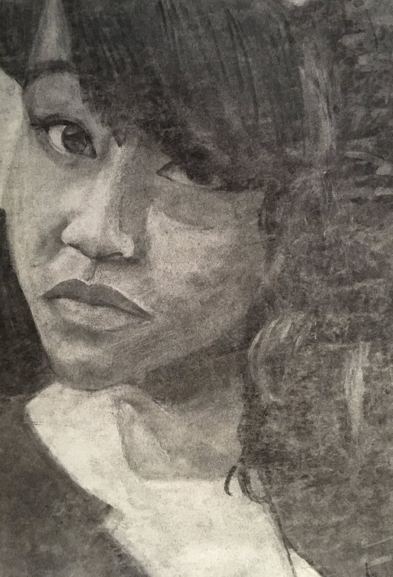 charcoal self portrait. black girl artist