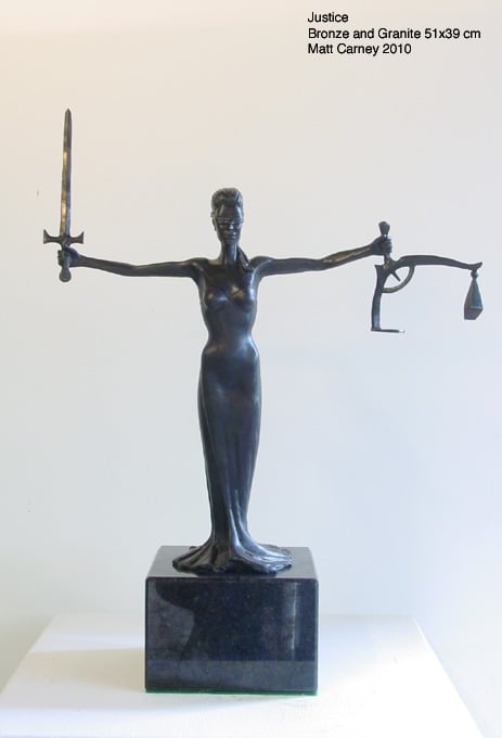 a statue of a lady justice 