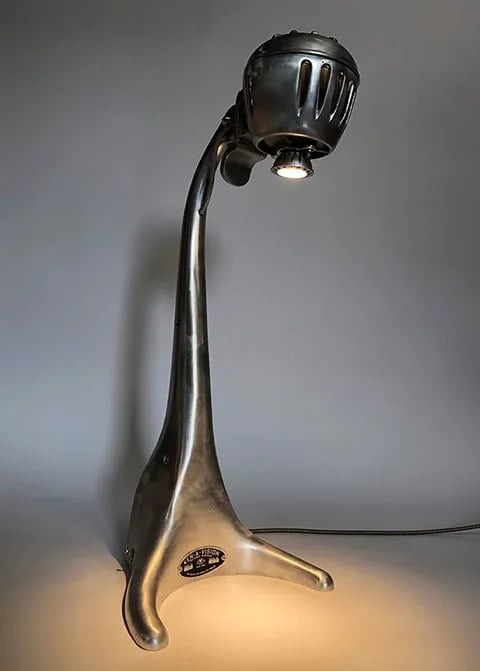 Custom light made from vintage microscope with long neck.