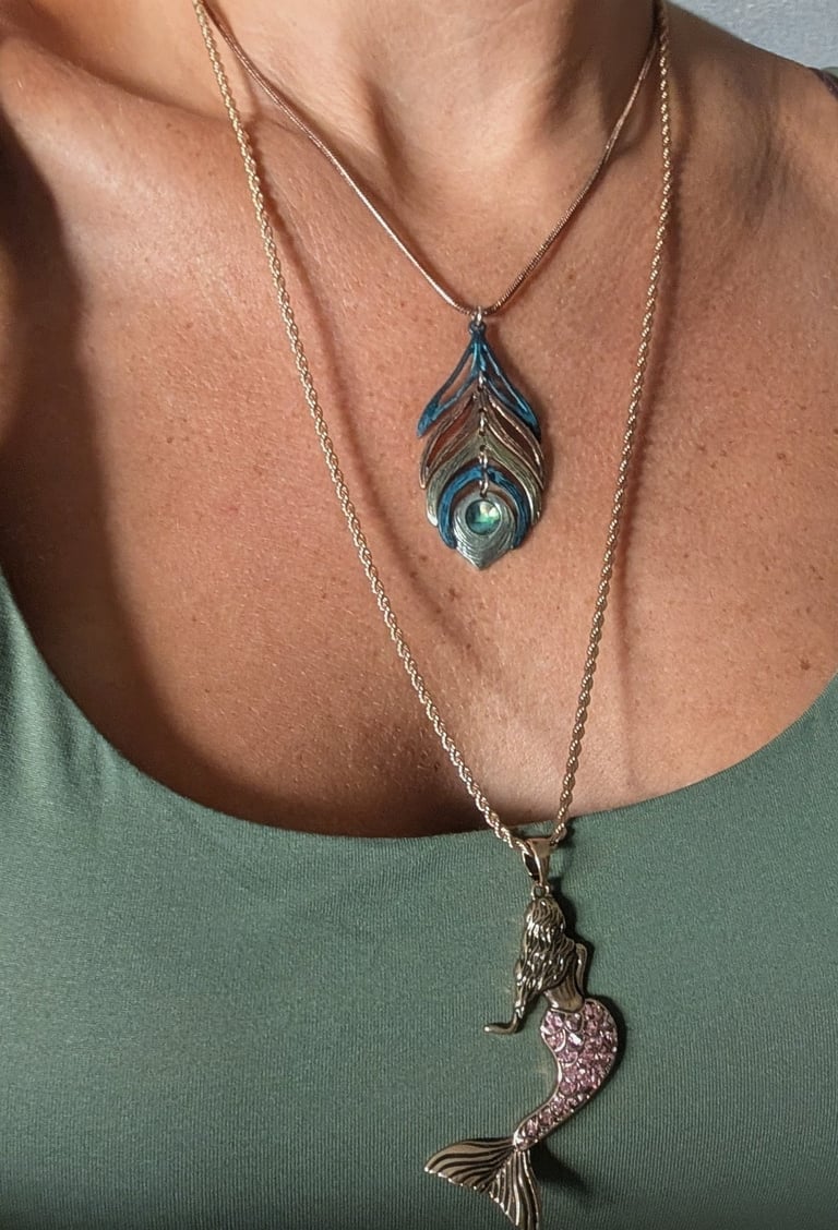 Pictured: peacock and mermaid necklace, layered 