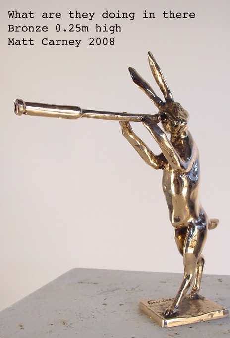 a sculpture of a rabbit looking through a telescope