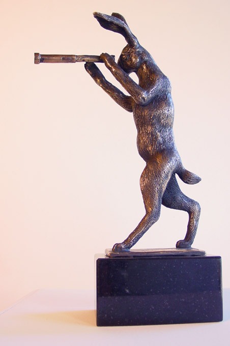 a sculpture of a rabbit looking through a telescope