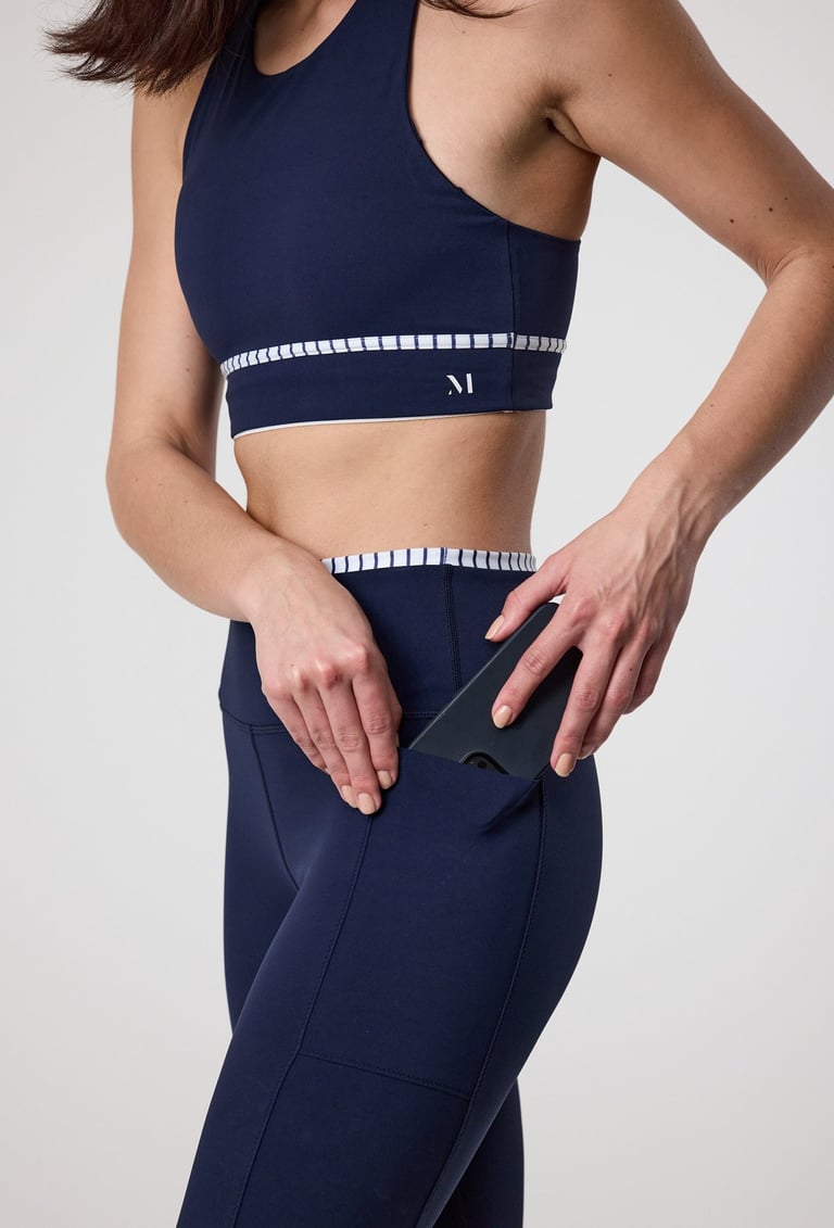 Fashion e-commerce photography - a woman in a sports bra top and leggings
