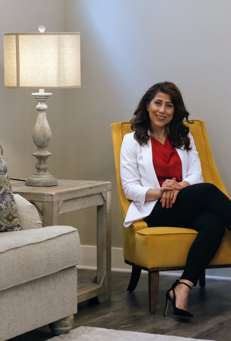 Neda Ramzei sitting in chair