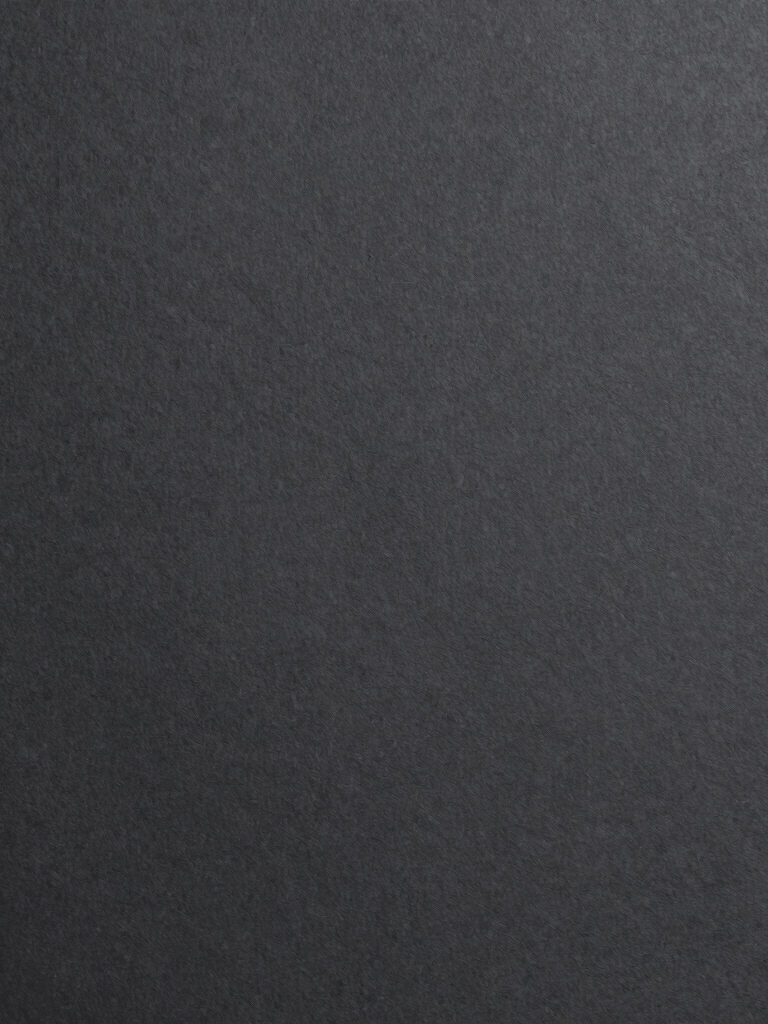 Minimalist photography of a high-quality charcoal paper texture in dark grey tones, uniform lighting, sophisticated and clean composition, European / Spanish aesthetic.