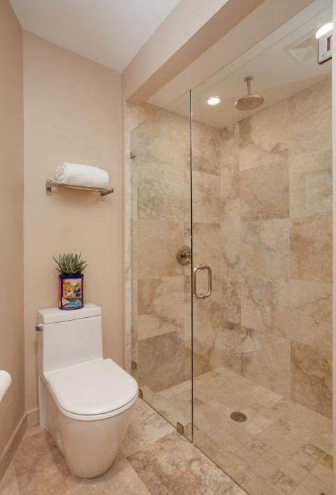 Modern bathroom remodel with floating vanity and round mirror