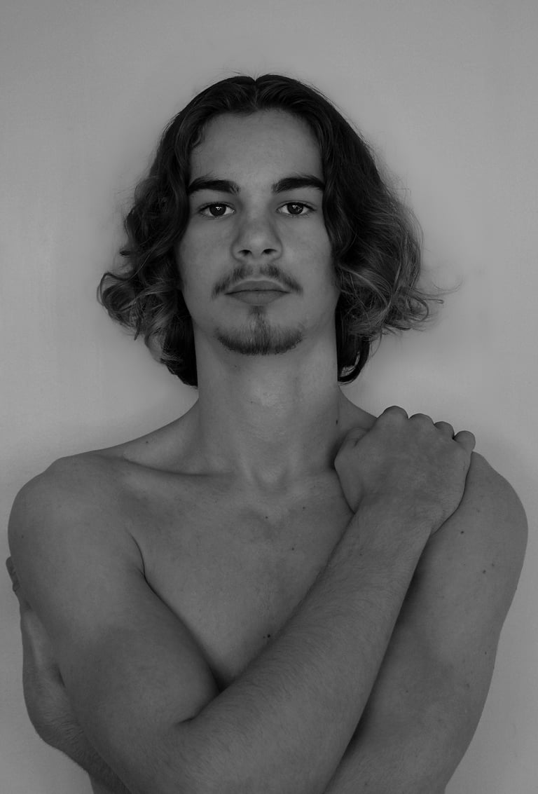 a man with a mustache and bare chest