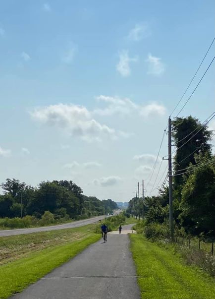 a person riding a bike down a trail