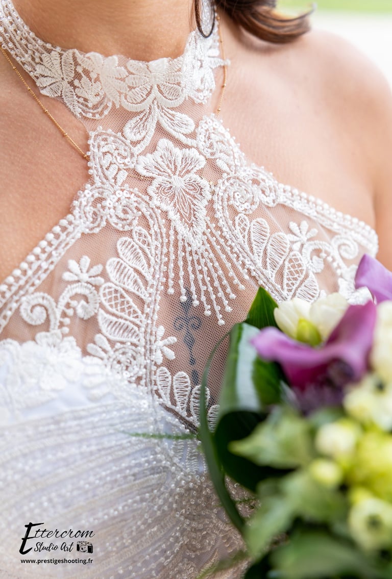 a woman in a wedding dress with a bouquet
