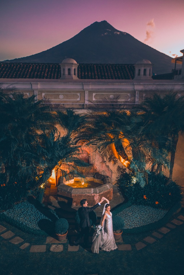 antigua guatemala wedding photograpaher- couple dancing with volcano in background