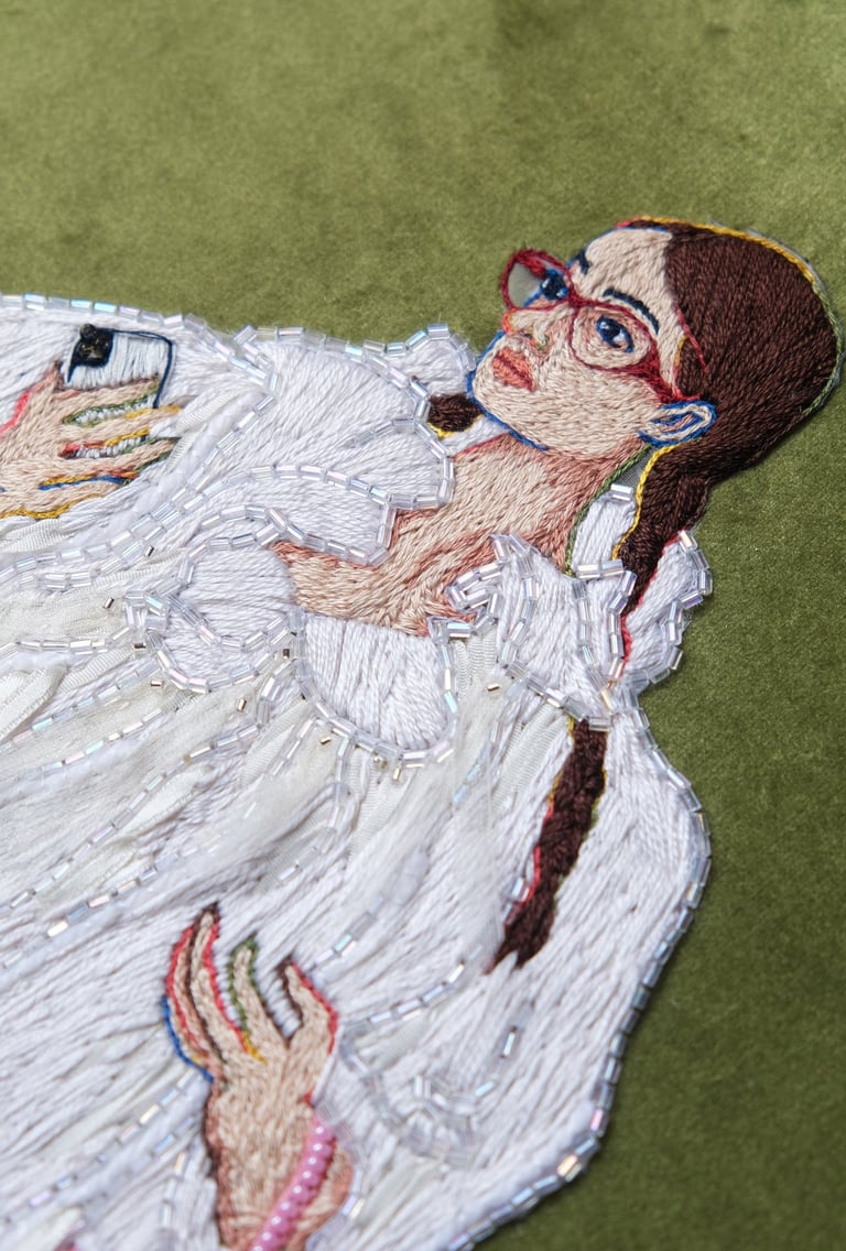 a woman in a white fur coat and boots embroidery and beaded pink bag