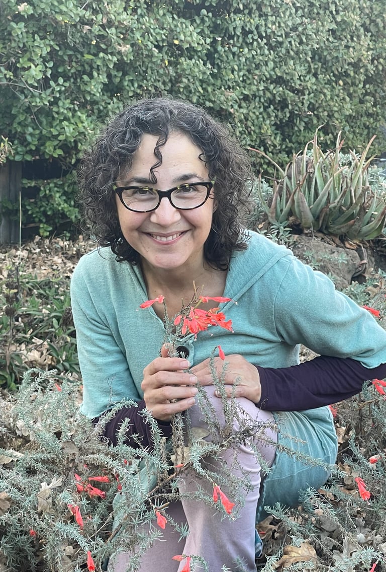 Katrina Matos, skin care formulator and Earth Energy Connection guide, with blooming California fuschia