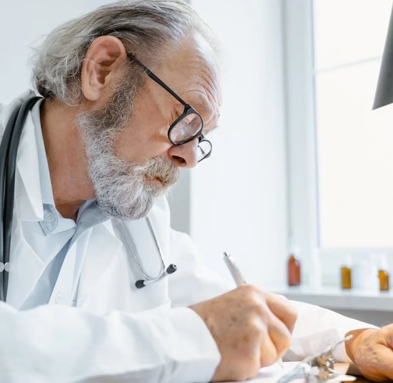 a doctor in a white coat and a stethrobe