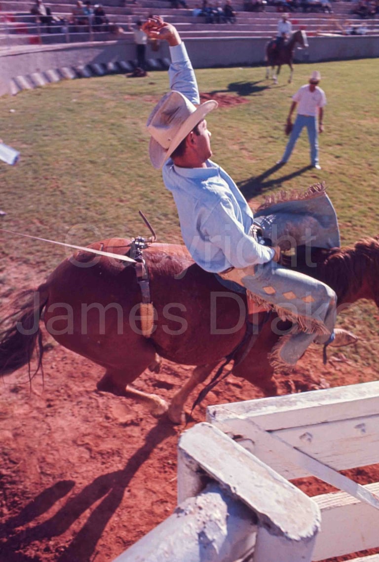 A bronc rider at the college rodeo finals in St. George, Utah, in 1967 by James Drake