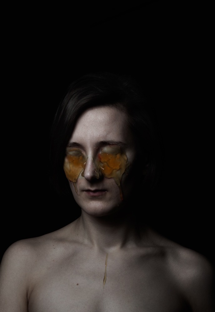 a woman with a face mask and a butterfly on her face