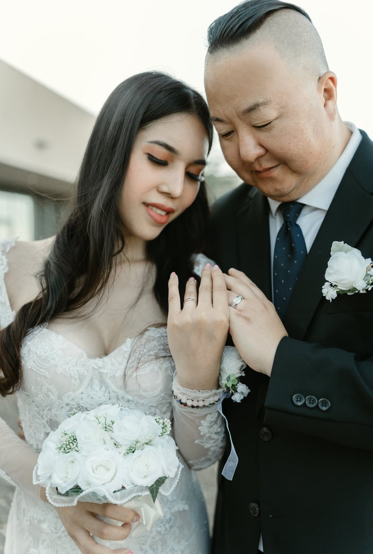 couple looking at thier rings