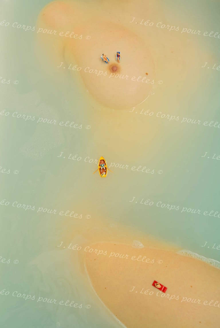 a couple of people are sitting on a beach