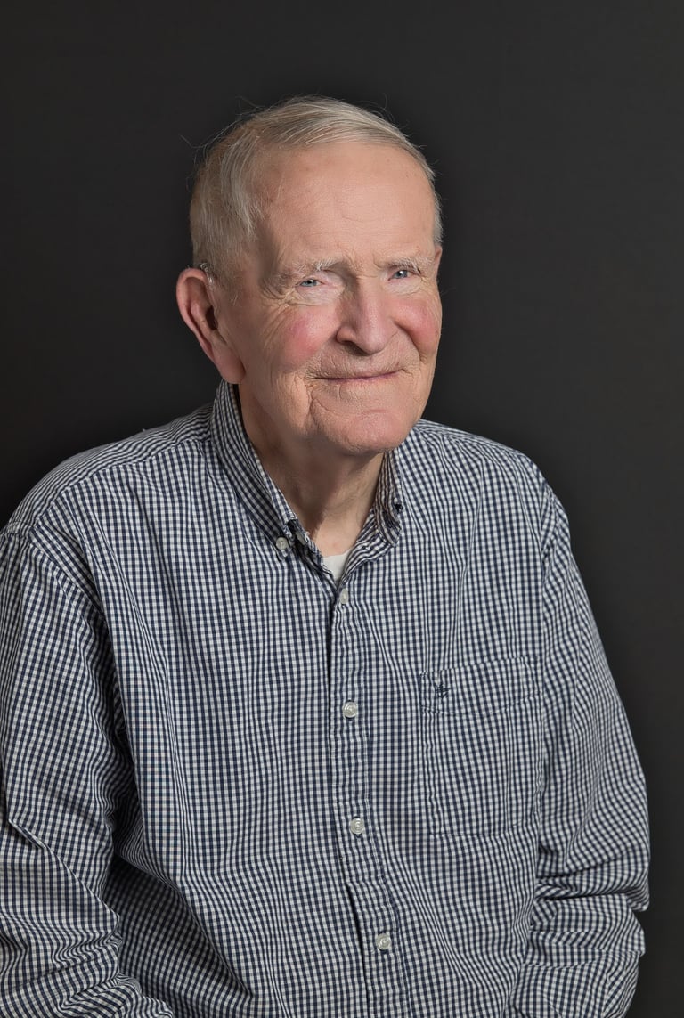 an old man in a blue shirt and a white shirt