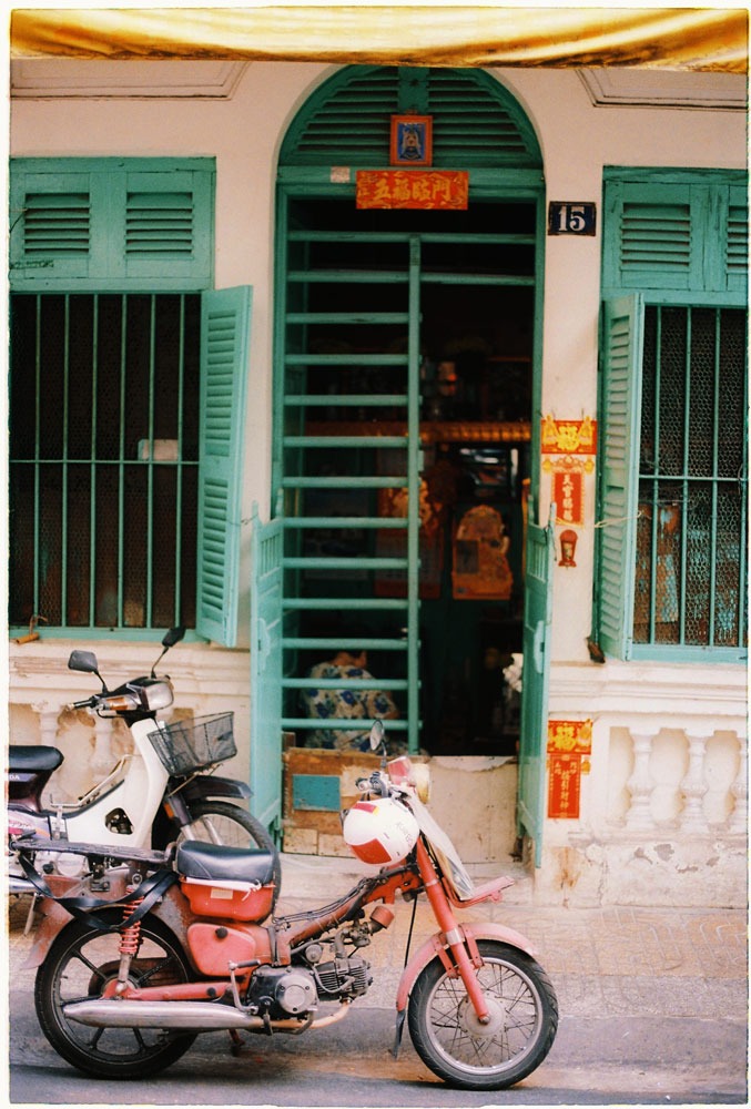 Vintage bike and colonial architecture door in Saigon China town