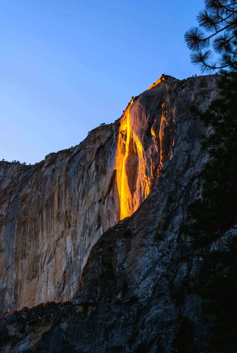 a waterfall flowing down a cliff face